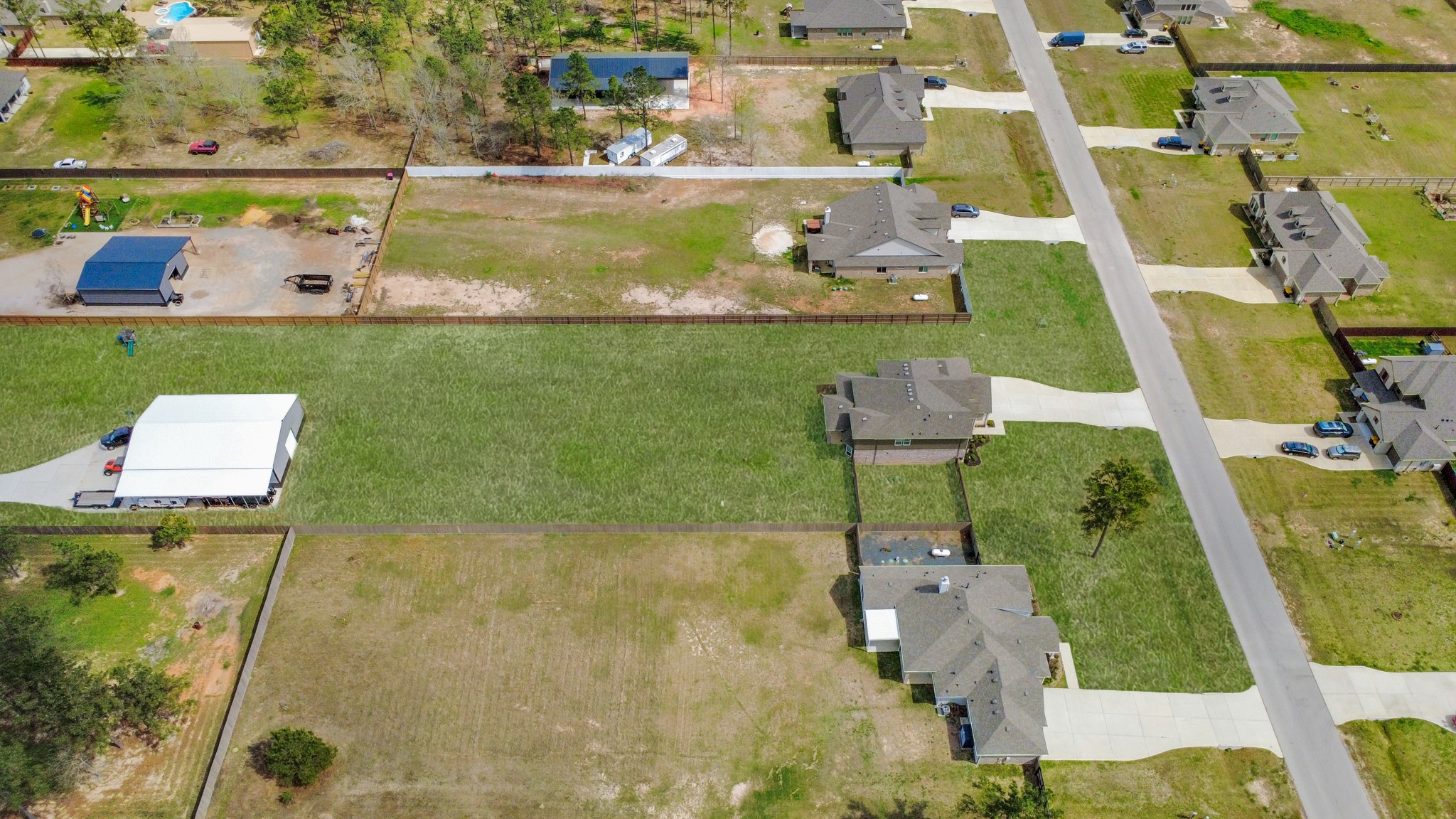 16735 Rockwall Street Conroe, TX 77303 - Photo 34 of 37 Ideally located just a short drive from The Woodlands, Conroe, and a wide variety of premier shopping, dining, entertainment, and everyday conveniences, this property offers the serenity of rural living while remaining close to everything you need.