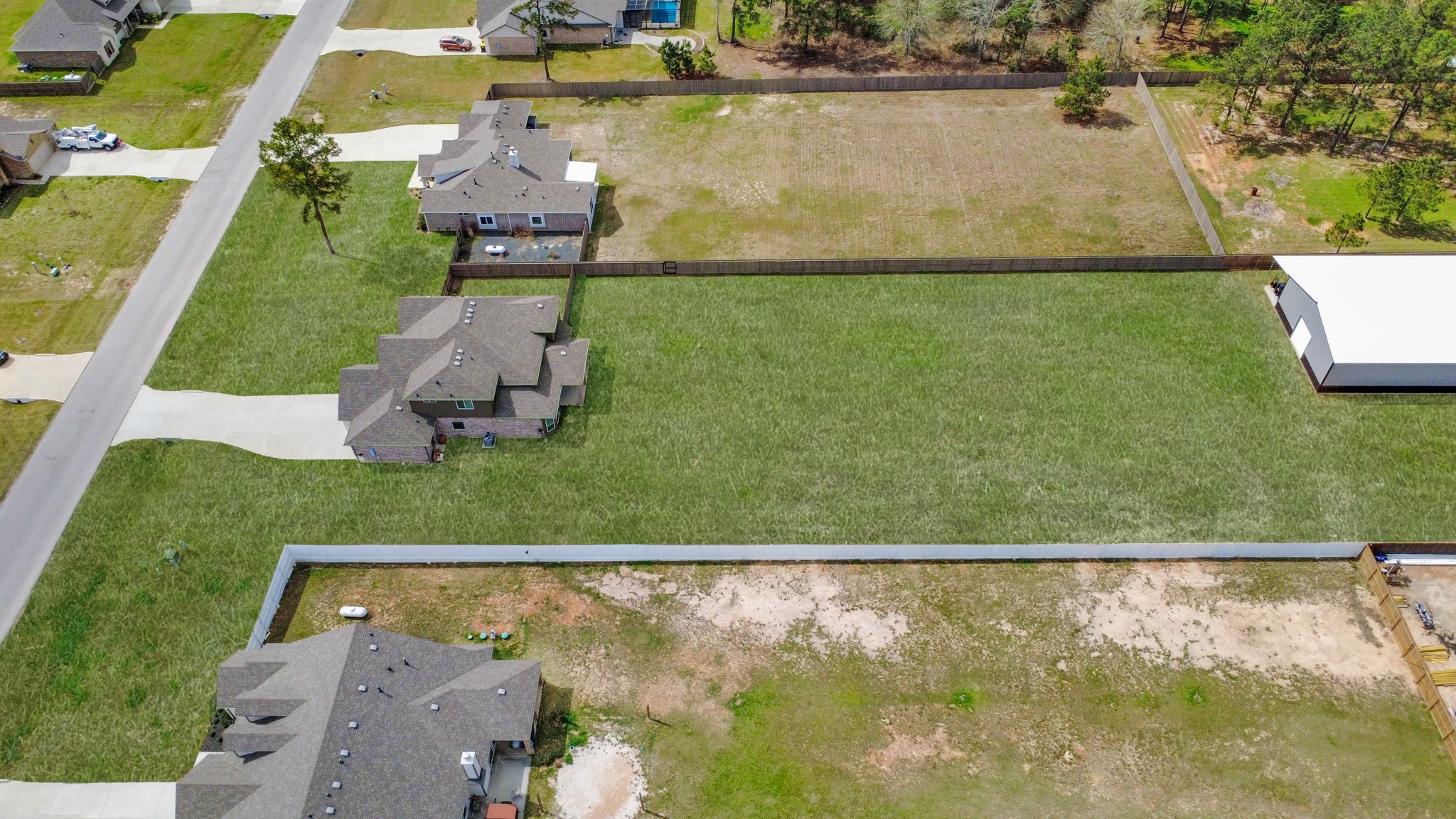 16735 Rockwall Street Conroe, TX 77303 - Photo 35 of 37 an aerial view of a house with a yard