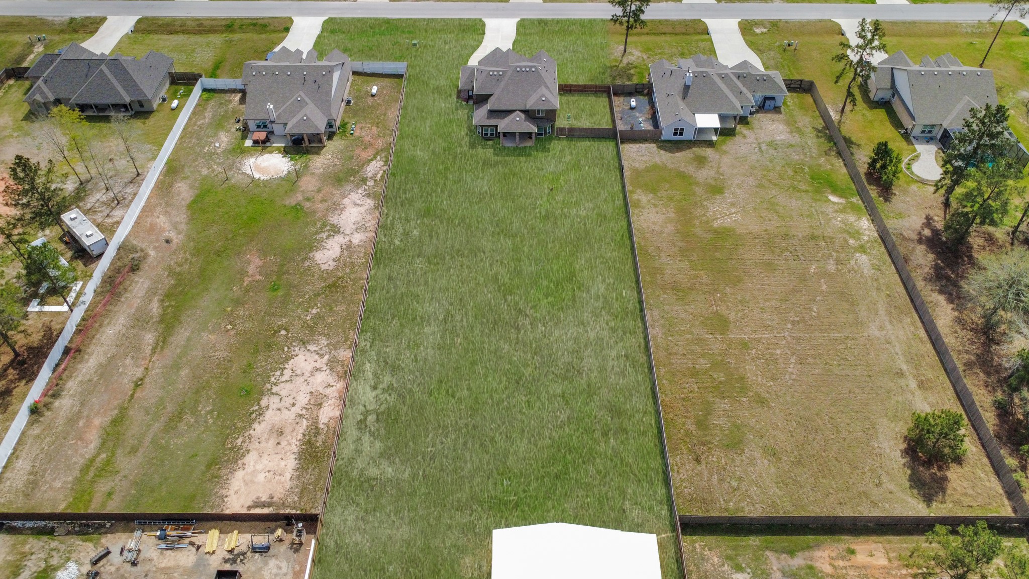 16735 Rockwall Street Conroe, TX 77303 - Photo 36 of 37 an aerial view of a house with swimming pool