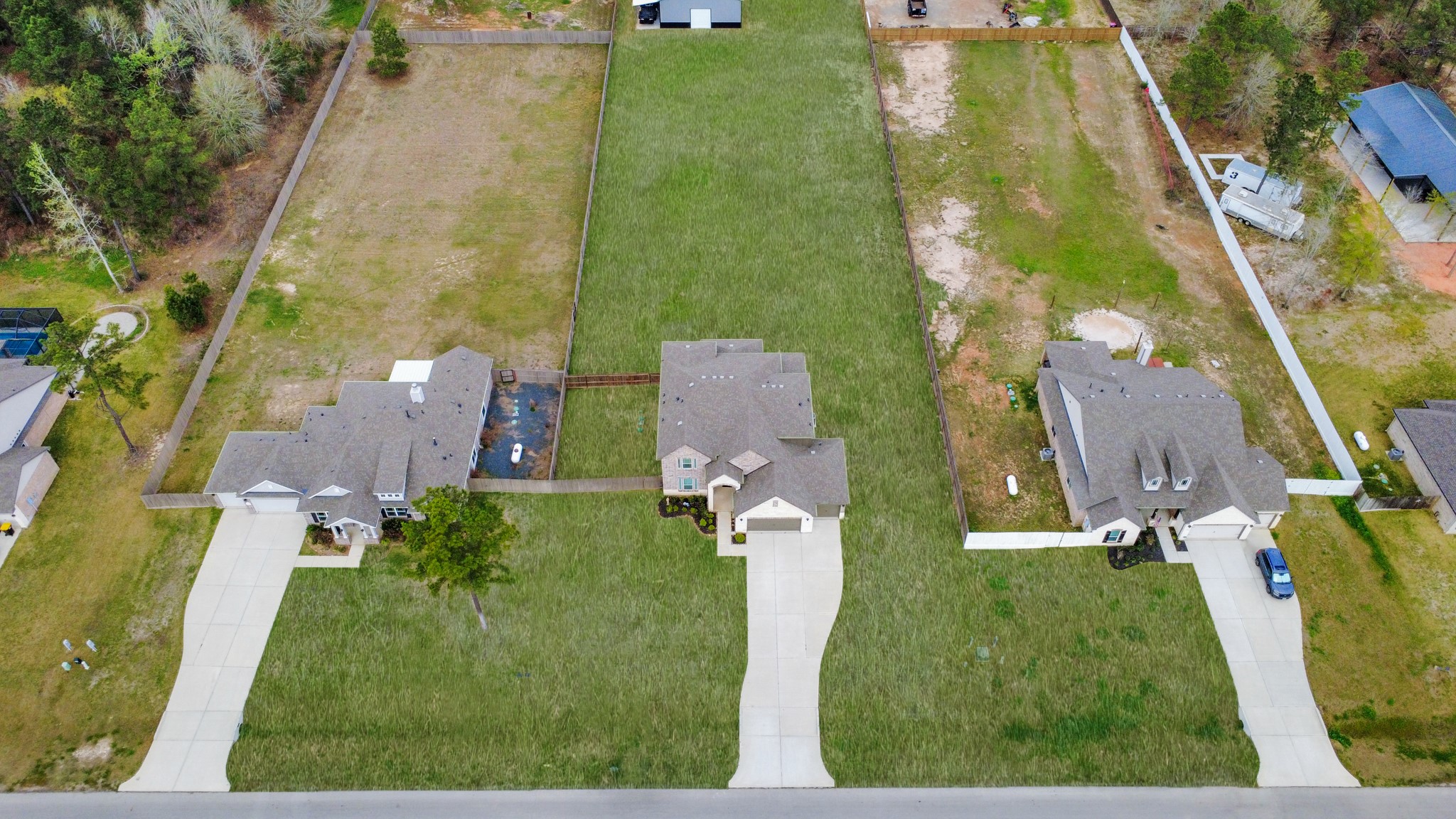 16735 Rockwall Street Conroe, TX 77303 - Photo 4 of 37 an aerial view of a house with a yard