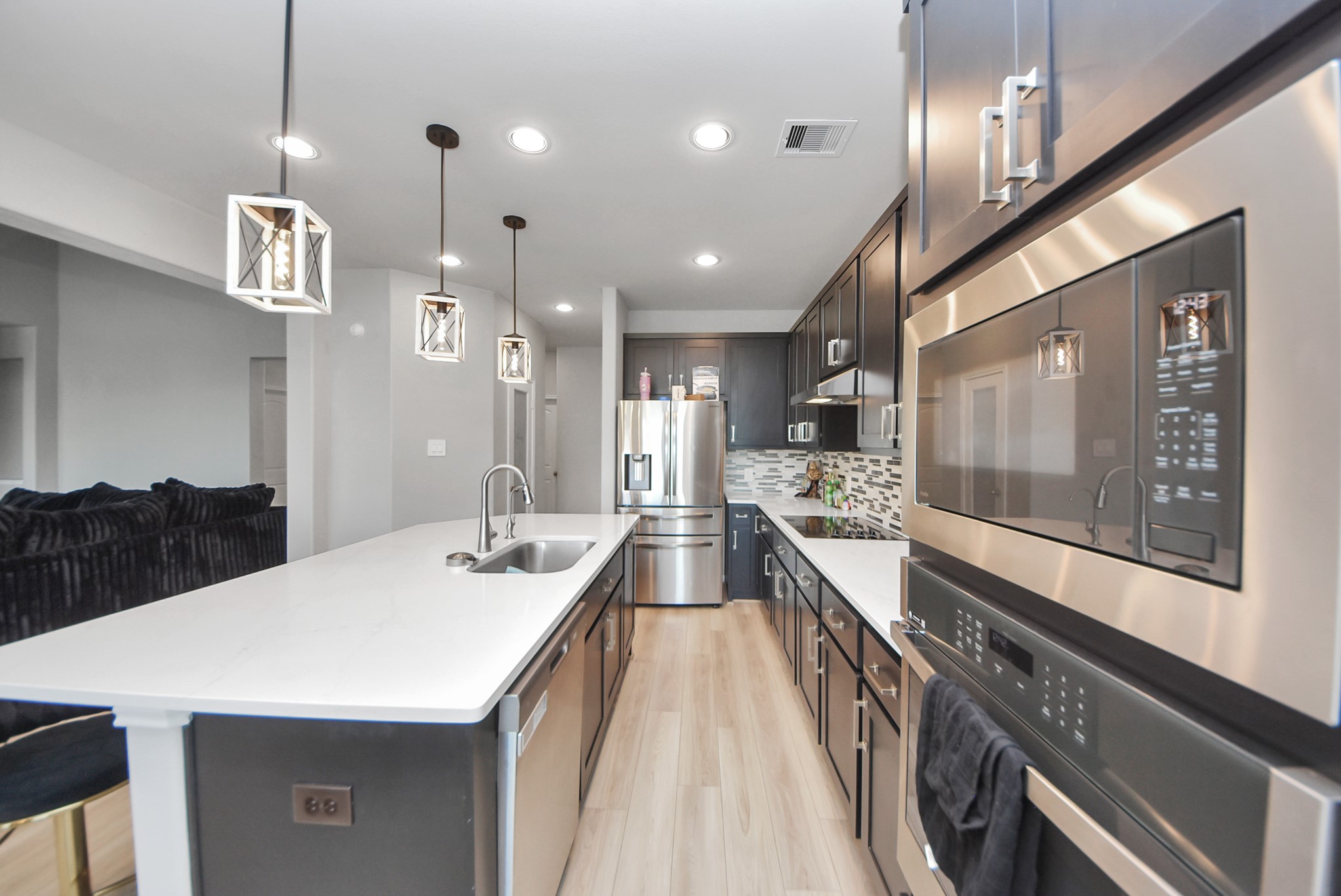 16735 Rockwall Street Conroe, TX 77303 - Photo 8 of 37 a large kitchen with kitchen island a large island in it