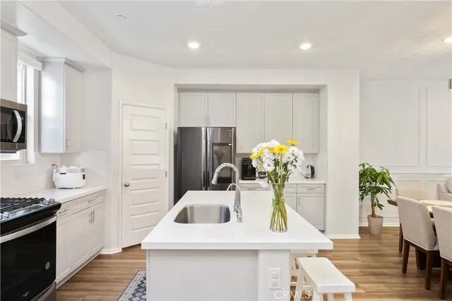 a cabinet with white and lots of different kinds of food