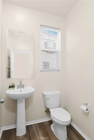 a bedroom with a bed and a lamp