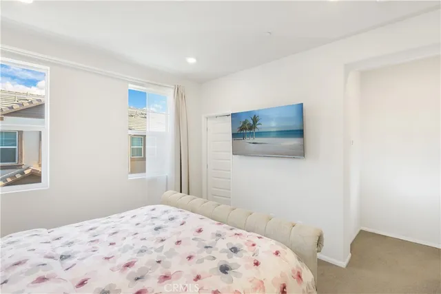 a bathroom with a double vanity sink mirror and shower
