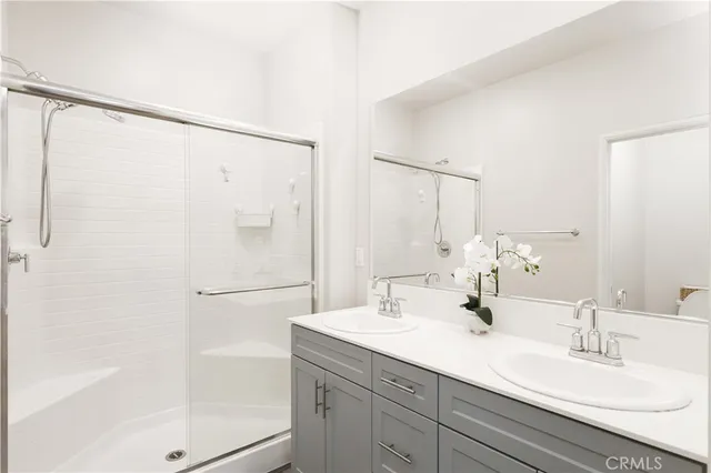 a view of walk in closet with clothes