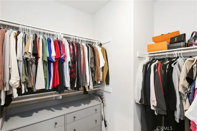 a bedroom with a bed and a desk