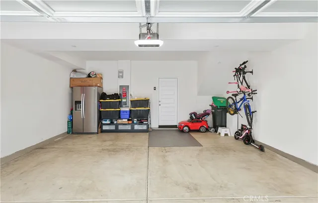 a front view of a house with a garden and patio