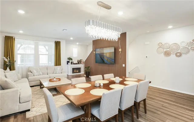 a kitchen with a sink stainless steel appliances and white cabinets