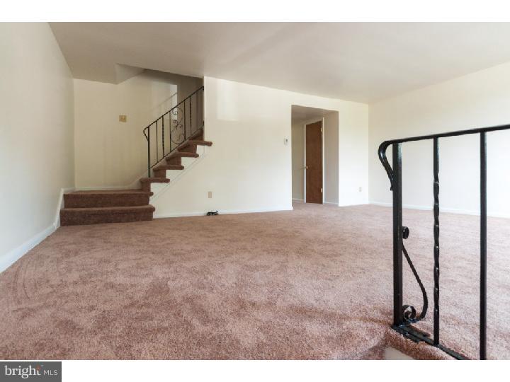 1307 Adair Road Brookhaven, PA 19015 - Photo 3 of 25 a view of an empty room with stairs