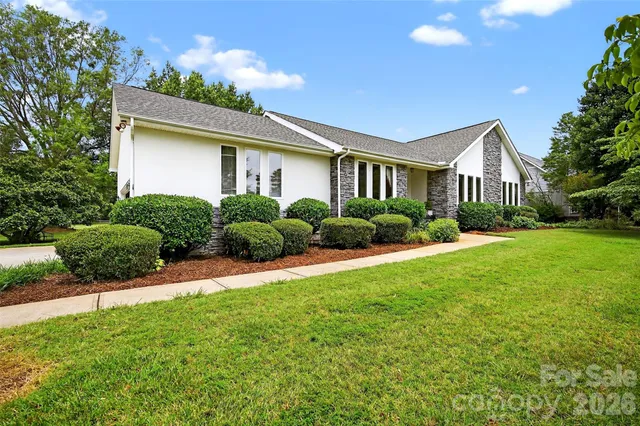 a front view of house with yard and green space