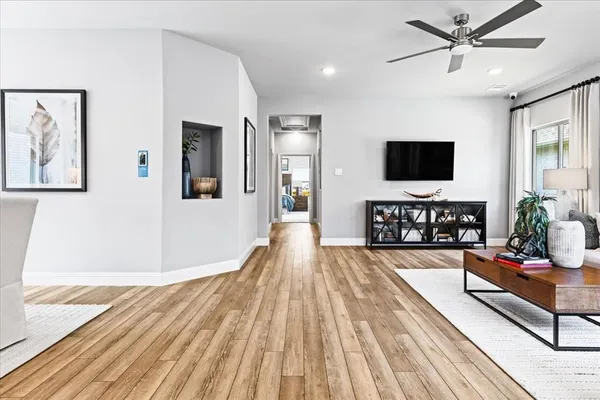 a living room with furniture and a flat screen tv