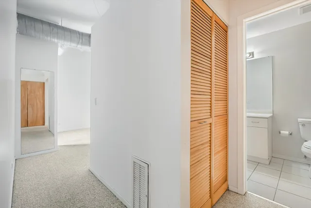 a view of bathroom with a shower and a sink