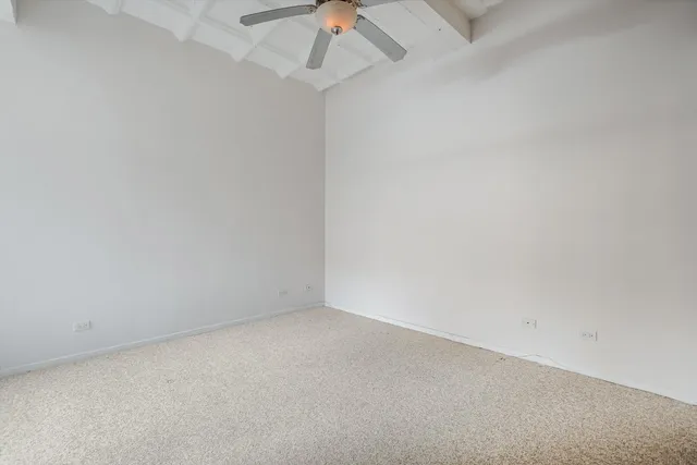 en empty room with a fan