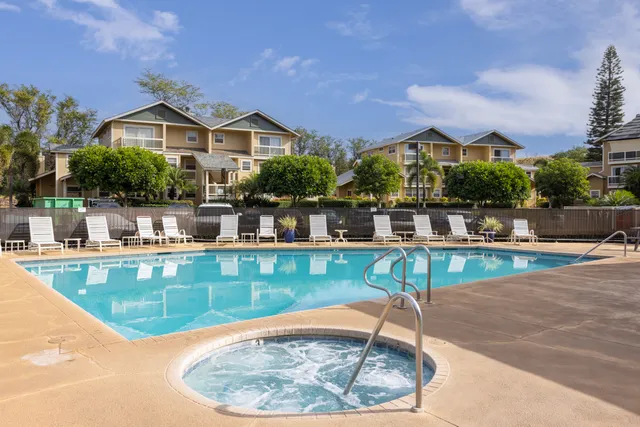 a view of a swimming pool with a lounge chairs