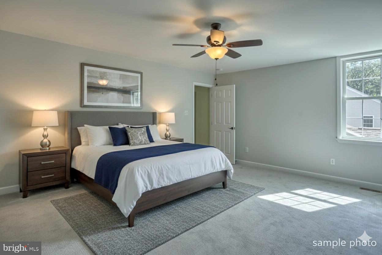 23 Castle Drive Robesonia, PA 19551 - Photo 10 of 15 a bedroom with a bed and a painting on the wall