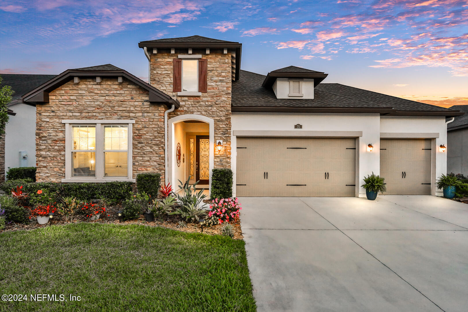 a front view of a house with a yard