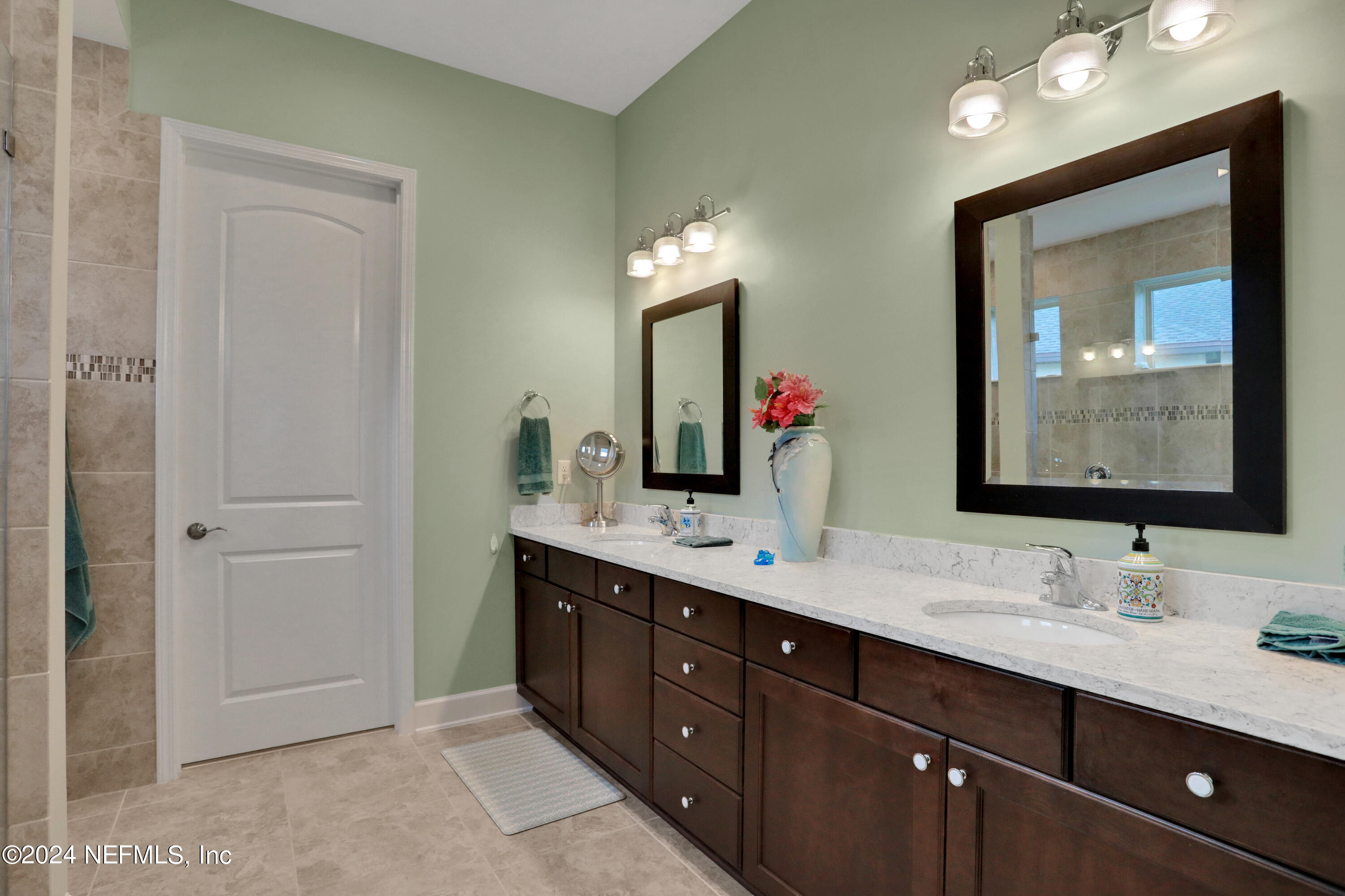 75 Hatter Drive Jacksonville, FL 32081 - Photo 11 of 45 a bathroom with a double vanity sink and a mirror