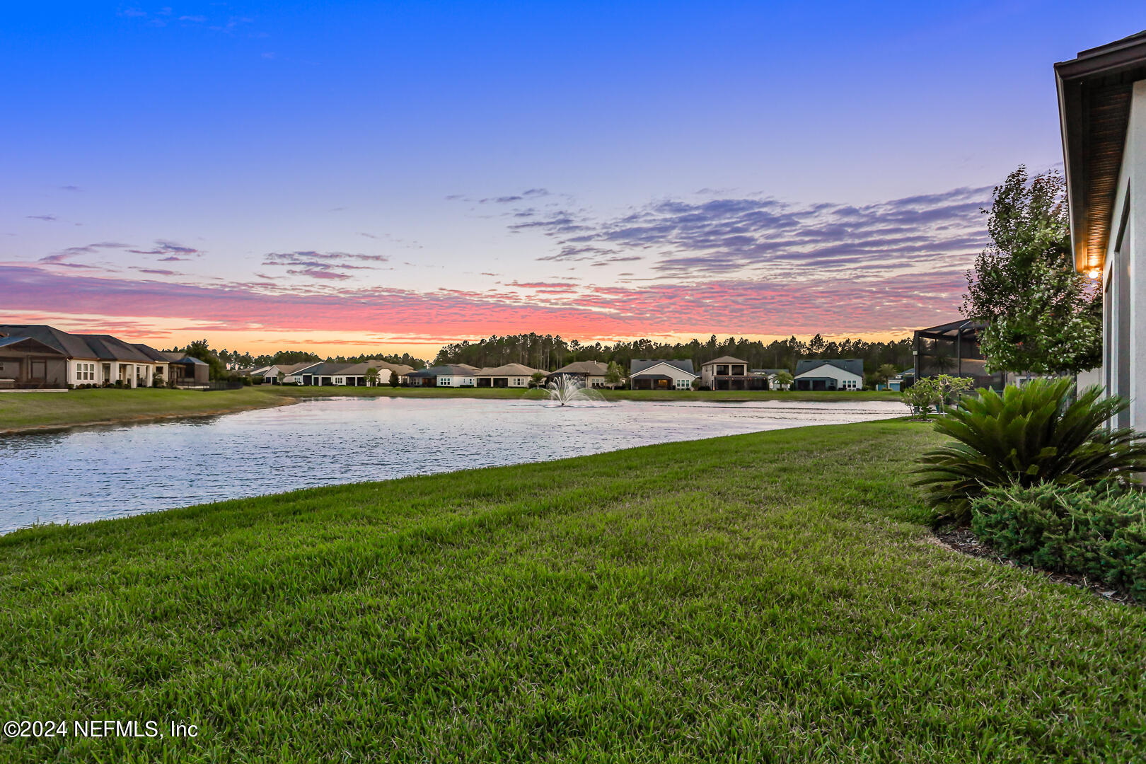 75 Hatter Drive Jacksonville, FL 32081 - Photo 21 of 45 a view of a lake with houses in the back