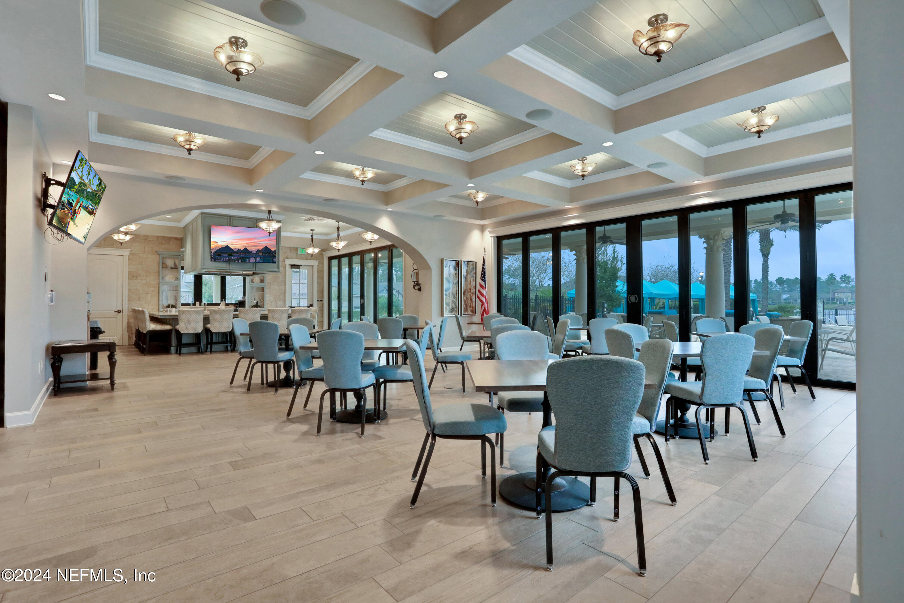 75 Hatter Drive Jacksonville, FL 32081 - Photo 27 of 45 a view of a dining room with furniture chandelier and glass door