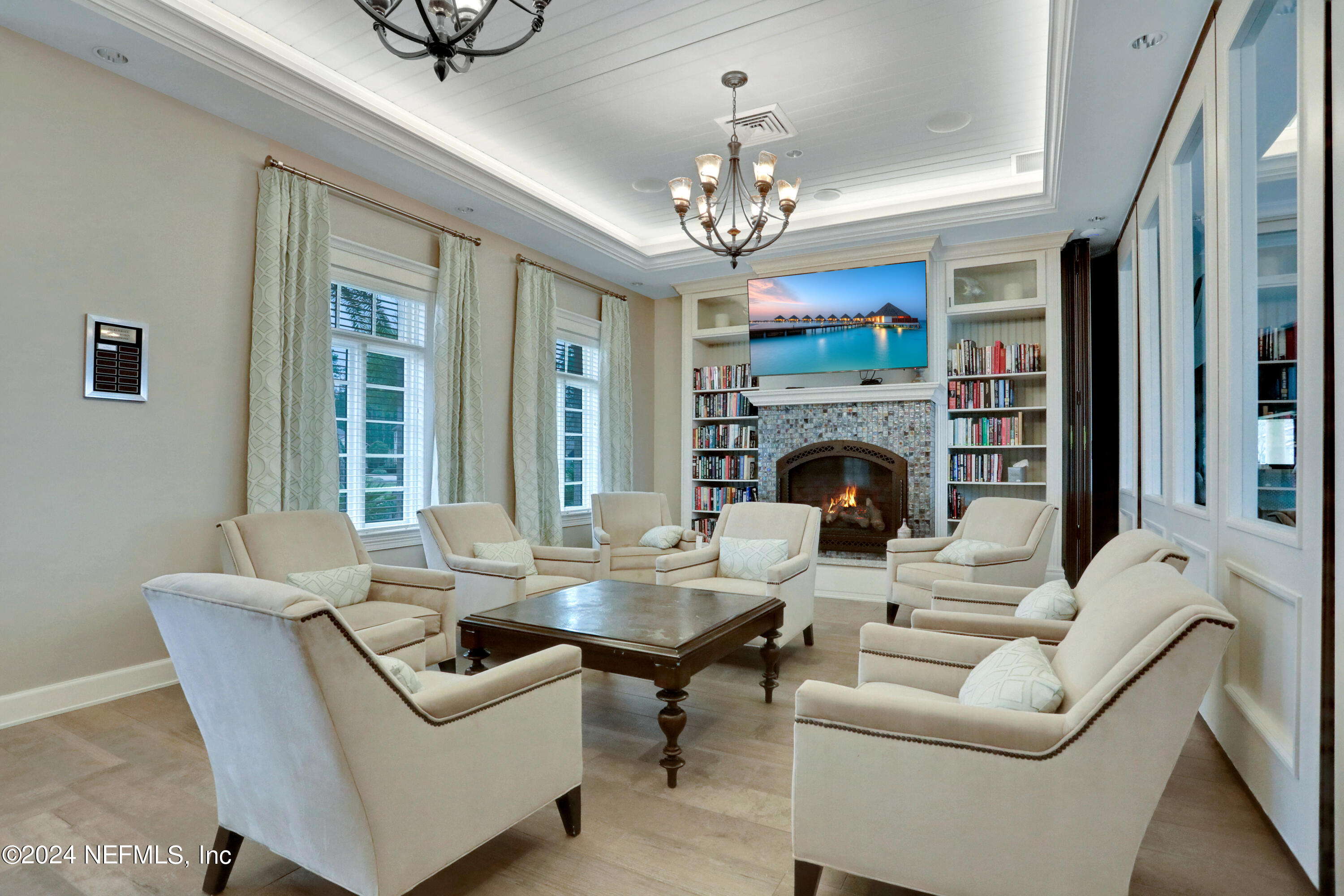 75 Hatter Drive Jacksonville, FL 32081 - Photo 32 of 45 a living room with furniture a chandelier and a fireplace