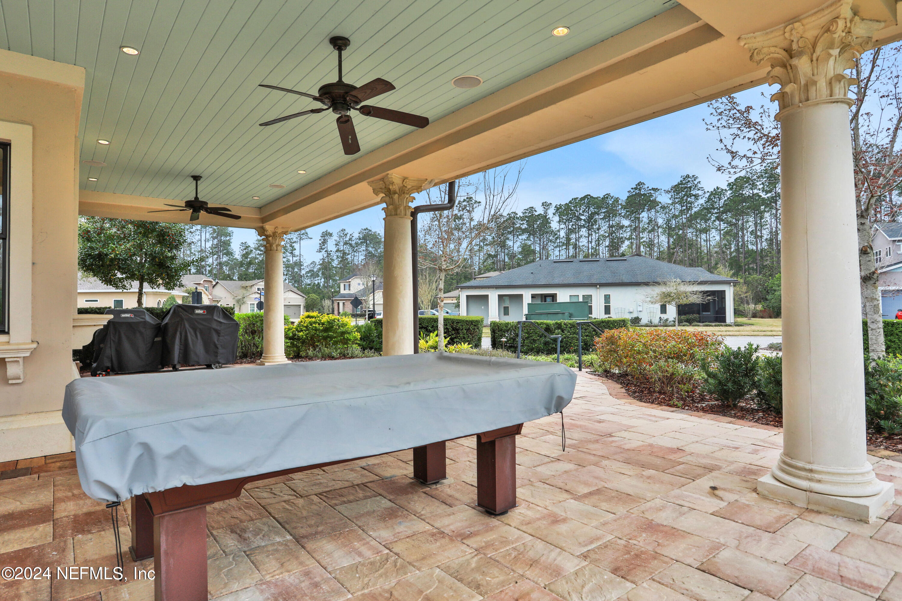 75 Hatter Drive Jacksonville, FL 32081 - Photo 40 of 45 a view of a patio with a table chairs and a porch