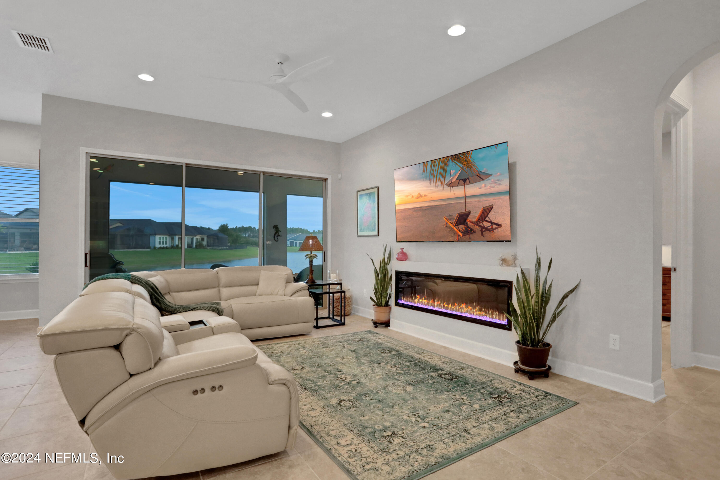75 Hatter Drive Jacksonville, FL 32081 - Photo 7 of 45 a living room with furniture a rug and a floor to ceiling window