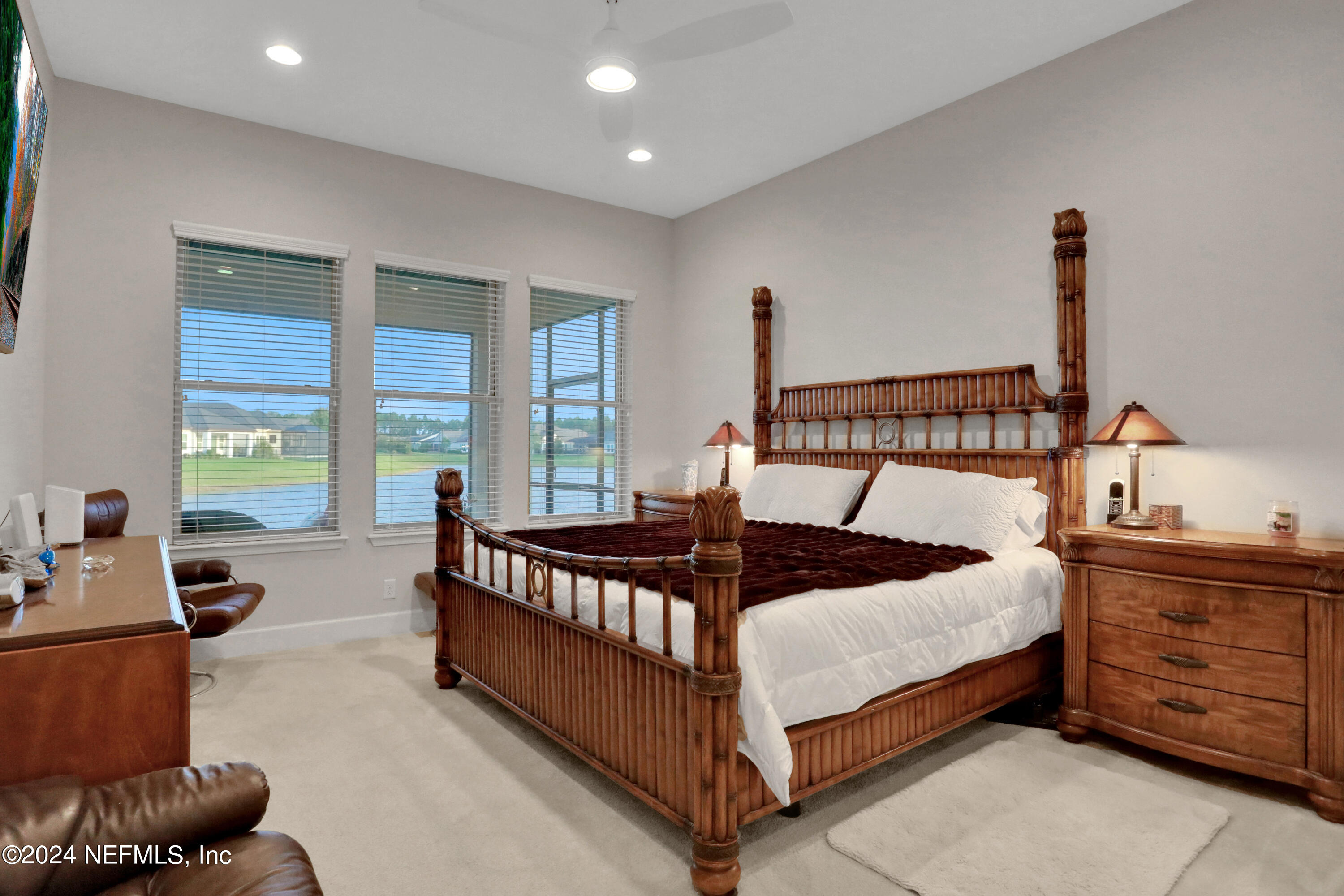 75 Hatter Drive Jacksonville, FL 32081 - Photo 9 of 45 a bed sitting in a spacious bedroom next to a window