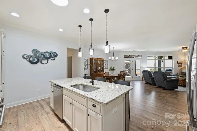 a view of living room with furniture and wooden floor