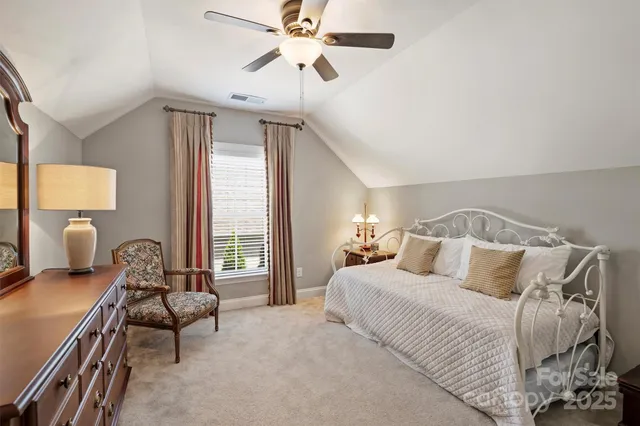 a bedroom with a bed and furniture