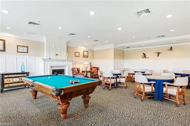 a large room with lots of chairs and chandelier