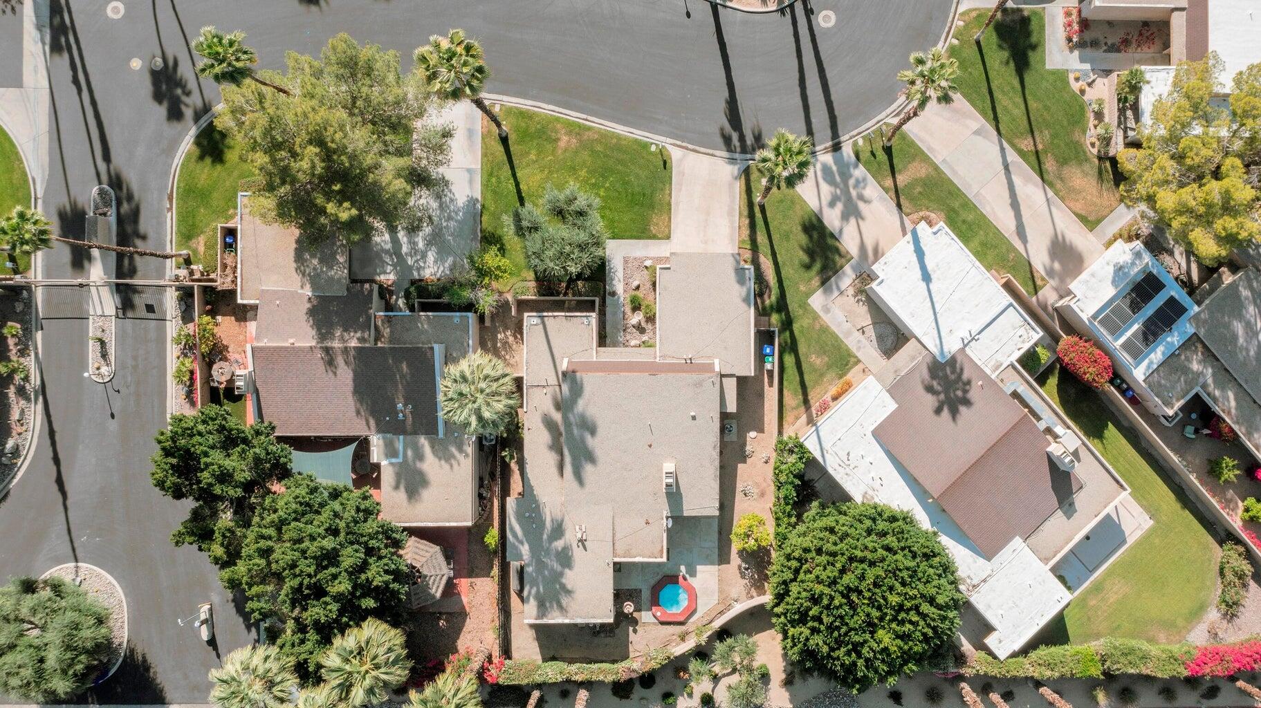 28 Chandra Lane Rancho Mirage, CA 92270 - Photo 4 of 13 an aerial view of a residential apartment building with a yard and potted plants