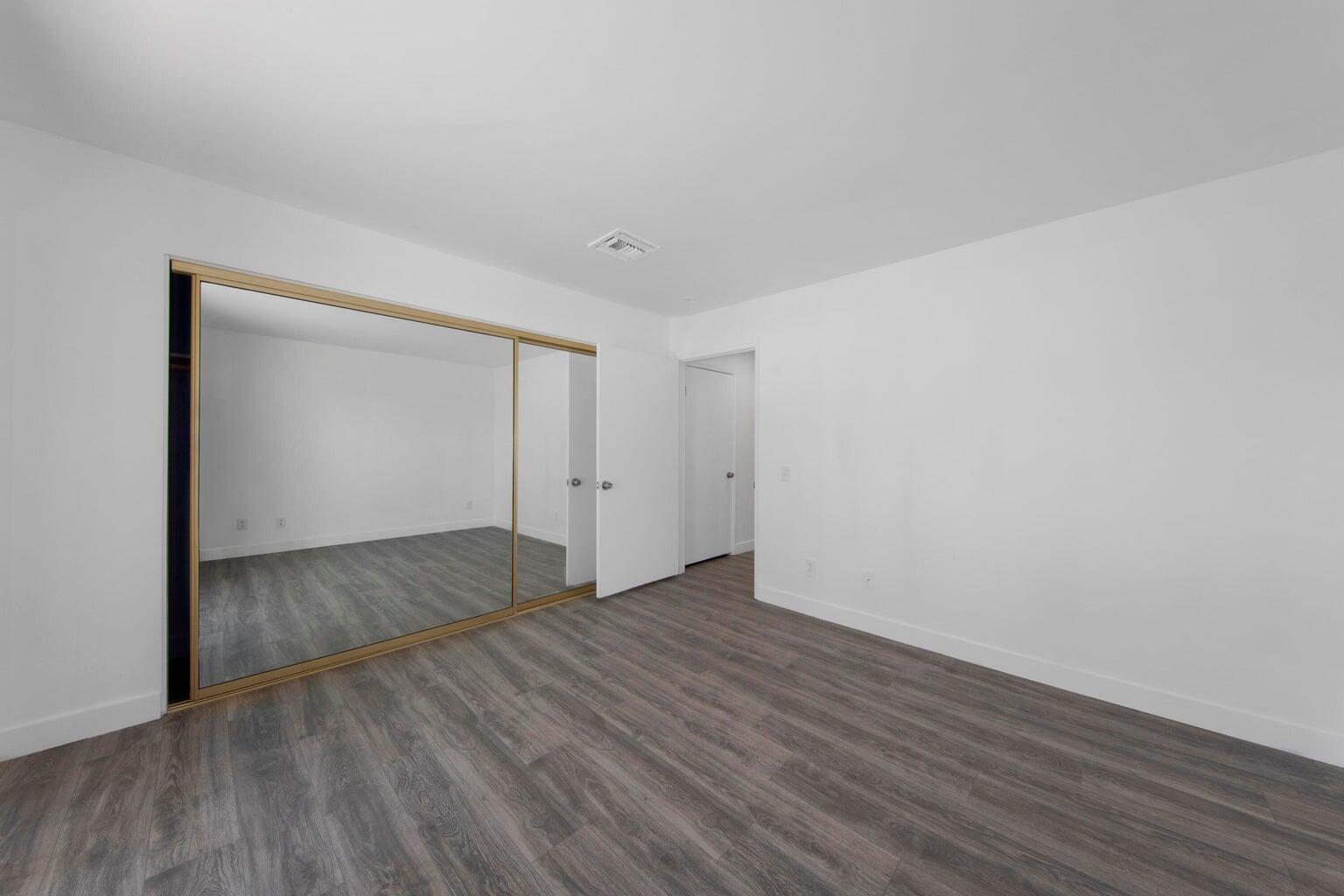 28 Chandra Lane Rancho Mirage, CA 92270 - Photo 8 of 13 a view of an empty room with wooden floor