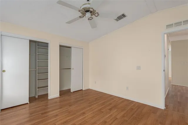 a bathroom with a double vanity sink and mirror