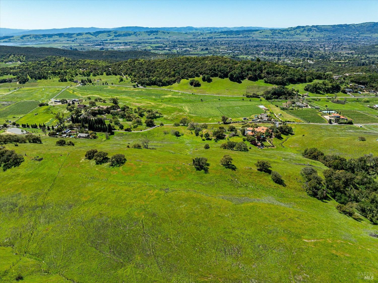4500 Lovall Valley Loop Road Sonoma, CA 95476 - Photo 9 of 17 a view of a lush green hillside and houses