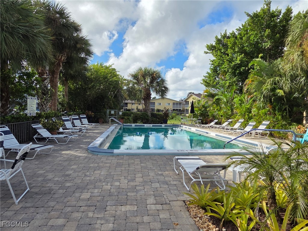 8135 Country Road, Unit 206 Fort Myers, FL 33919 - Photo 11 of 11 a view of a backyard with plants and lake view