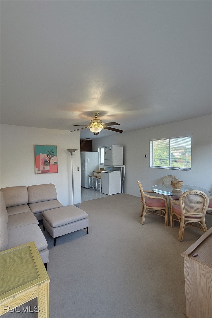 8135 Country Road, Unit 206 Fort Myers, FL 33919 - Photo 4 of 11 a living room with furniture and a window