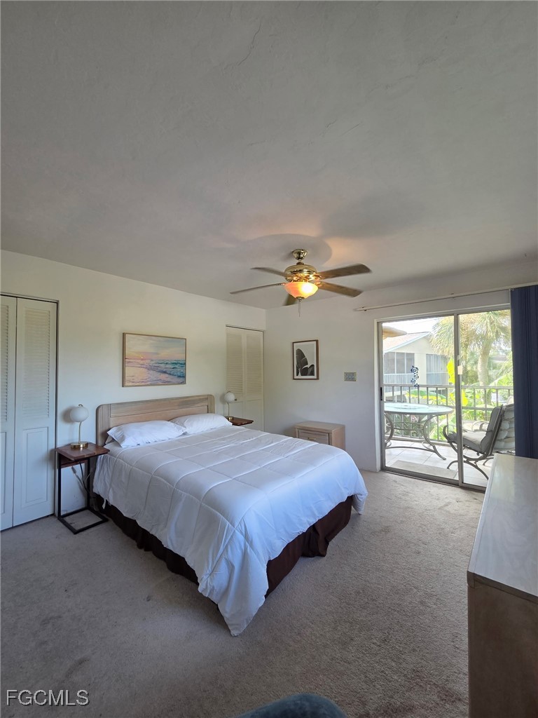 8135 Country Road, Unit 206 Fort Myers, FL 33919 - Photo 6 of 11 a bedroom with a large bed and a large window