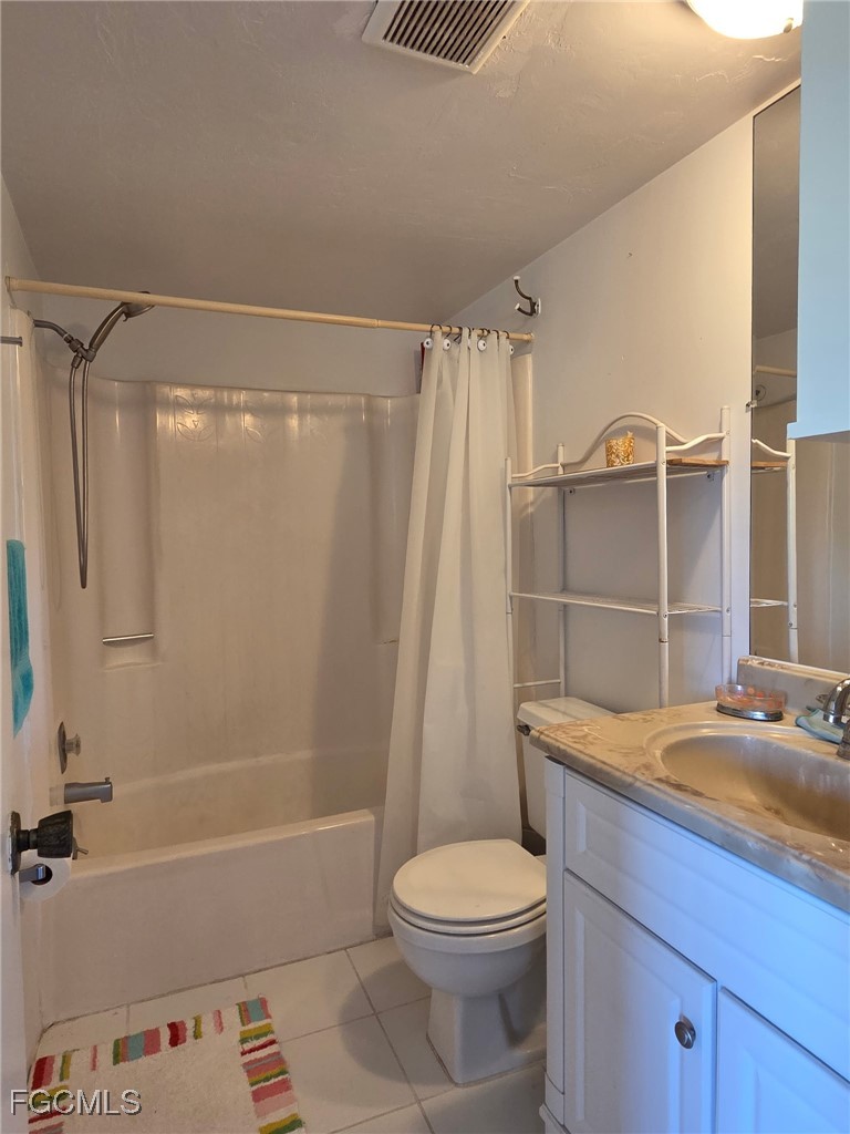 8135 Country Road, Unit 206 Fort Myers, FL 33919 - Photo 8 of 11 a bathroom with a sink toilet and shower