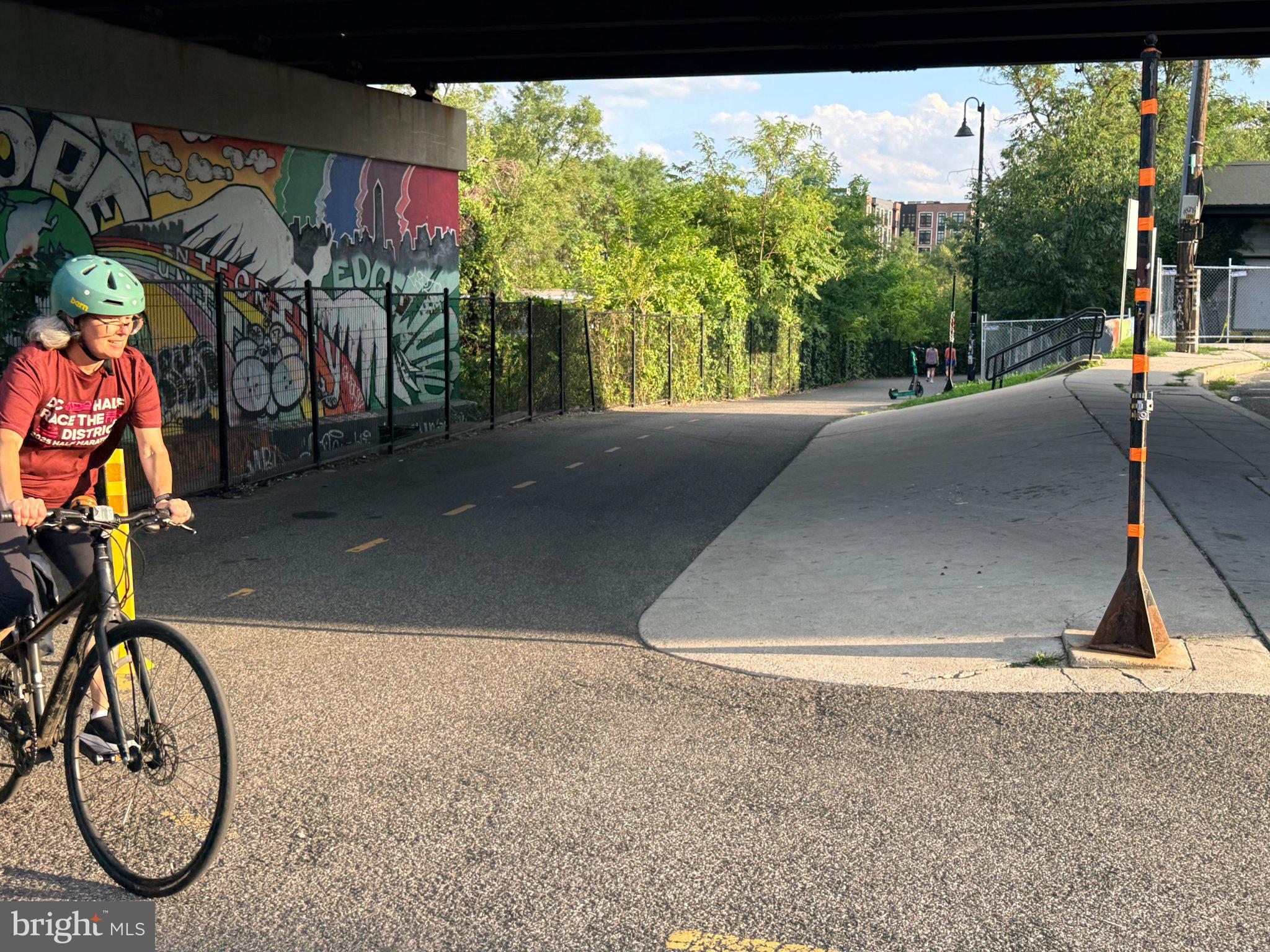 2920 8th Street Northeast, Unit 2 Washington, DC 20017 - Photo 28 of 30 Urban cyclist on a vibrant path.