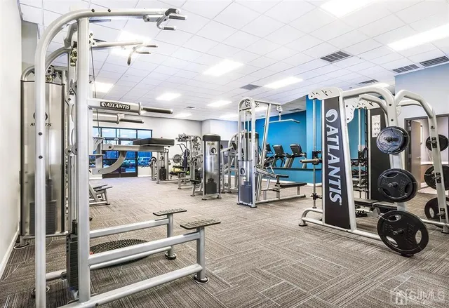 a view of a dining room with furniture and window