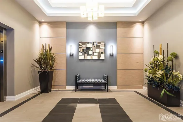 a living room with furniture kitchen and a table