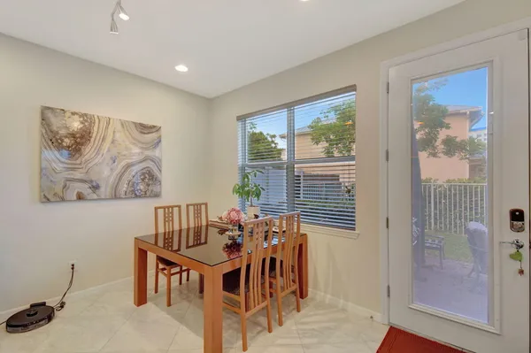 a view of a dining room with furniture window and outside view