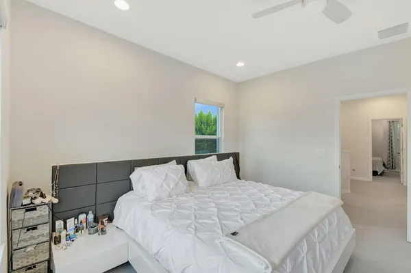 a bedroom with a bed and with furniture