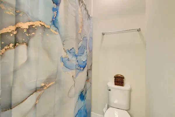 a bathroom with a sink and toilet