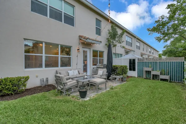 a front view of house with yard and outdoor seating