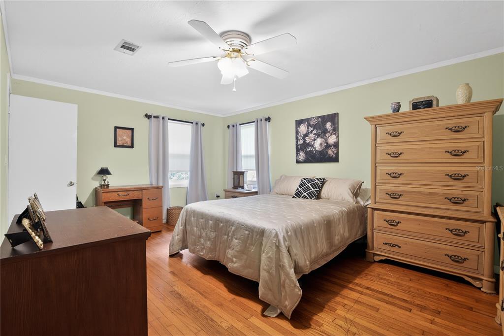 1803 Southeast 3rd Avenue Ocala, FL 34471 - Photo 13 of 29 a bedroom with a bed and a dresser