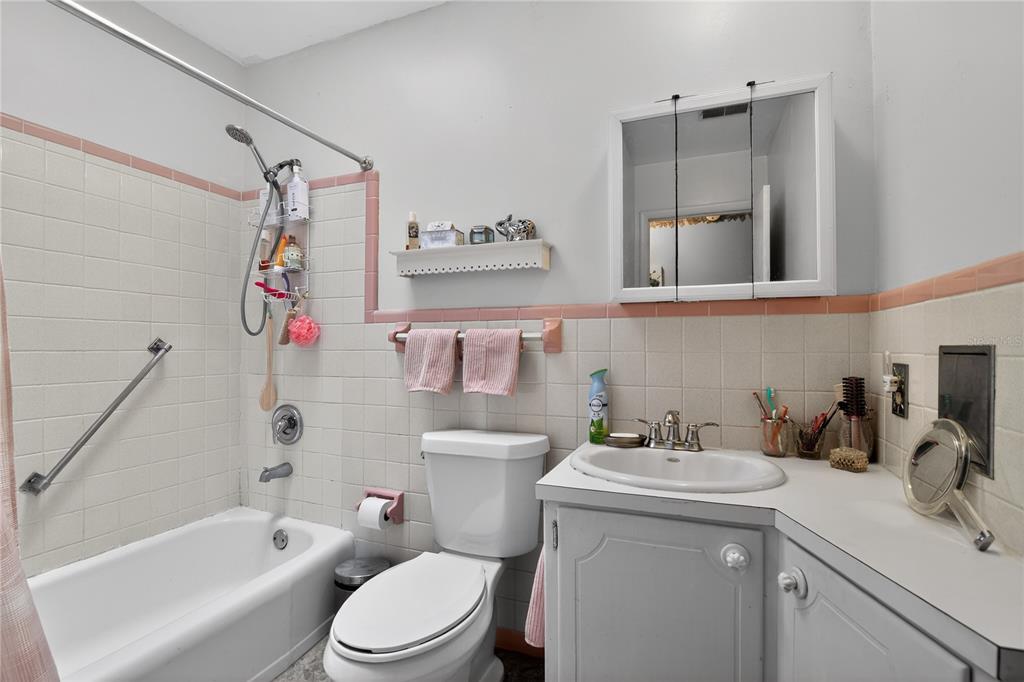 1803 Southeast 3rd Avenue Ocala, FL 34471 - Photo 15 of 29 a bathroom with a sink toilet vanity tub and shower