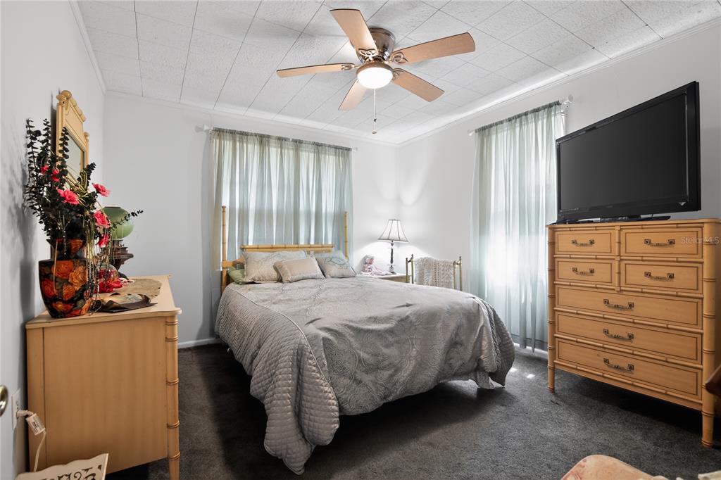 1803 Southeast 3rd Avenue Ocala, FL 34471 - Photo 16 of 29 a bedroom with a bed and a flat screen tv