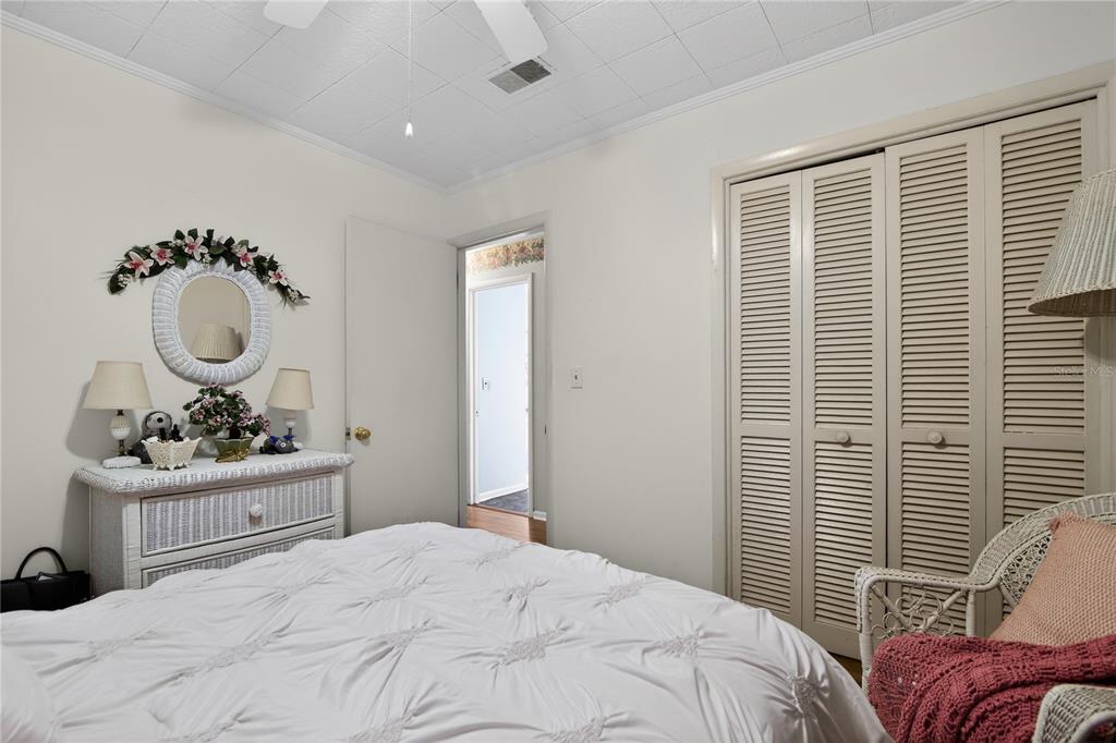 1803 Southeast 3rd Avenue Ocala, FL 34471 - Photo 18 of 29 a bedroom with a bed and wooden floor