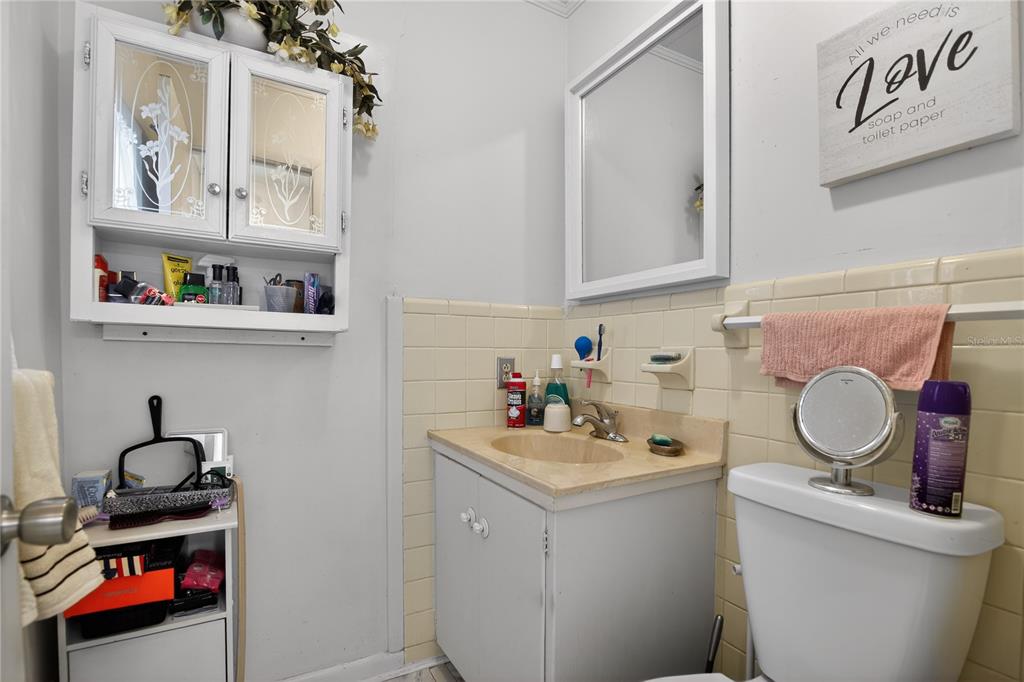 1803 Southeast 3rd Avenue Ocala, FL 34471 - Photo 22 of 29 a bathroom with a sink toilet and vanity